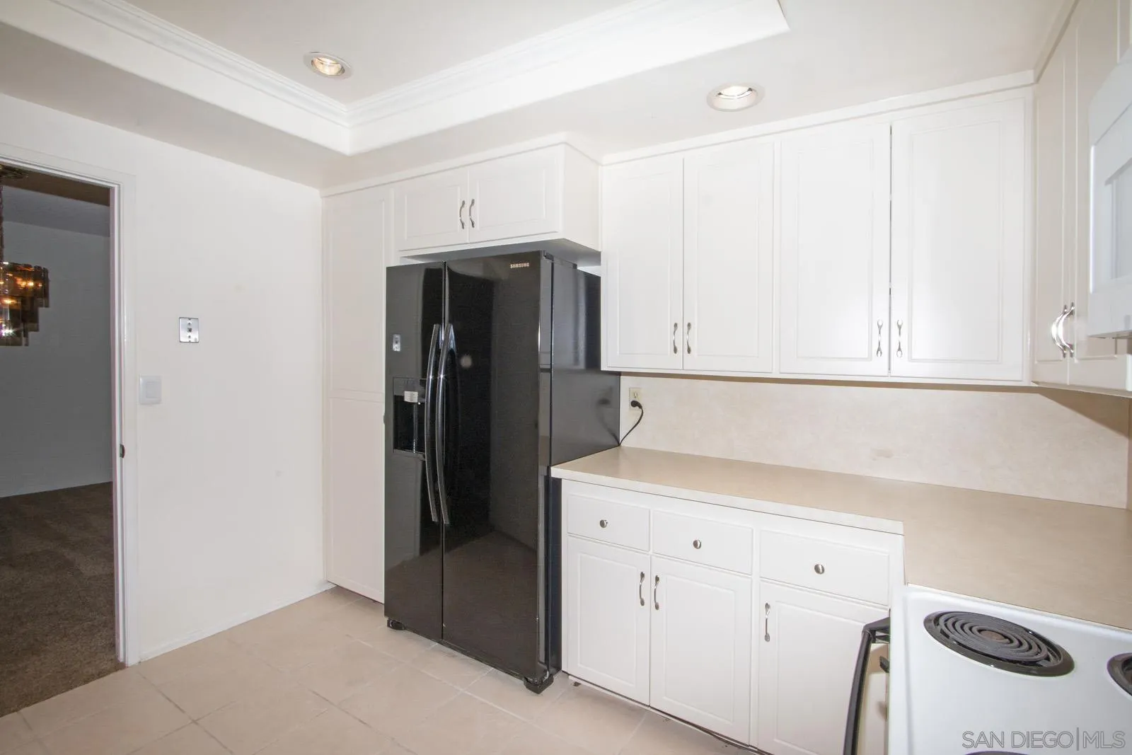 12475 Rios Road San Diego, CA 92128 - Photo 13 of 34 a utility room with cabinets washer and dryer