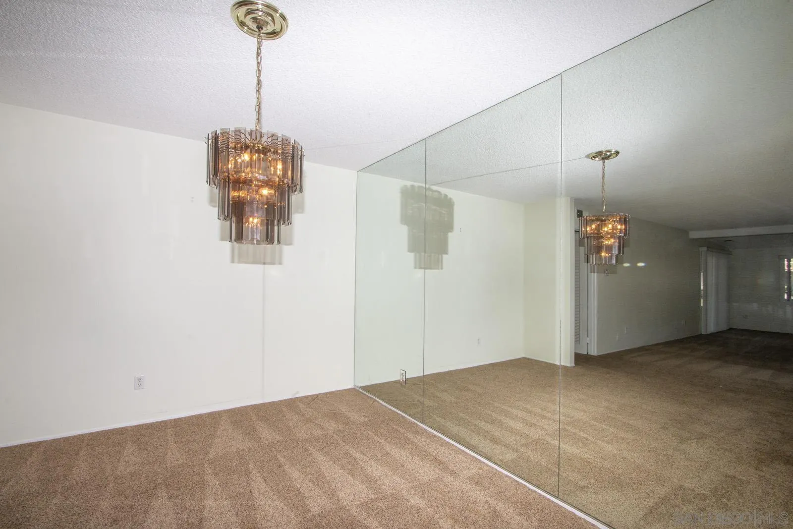 12475 Rios Road San Diego, CA 92128 - Photo 6 of 34 a view of empty room with a ceiling fan