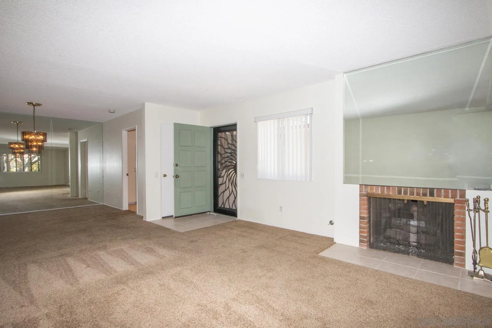 12475 Rios Road San Diego, CA 92128 - Photo 8 of 34 an empty room with a fireplace