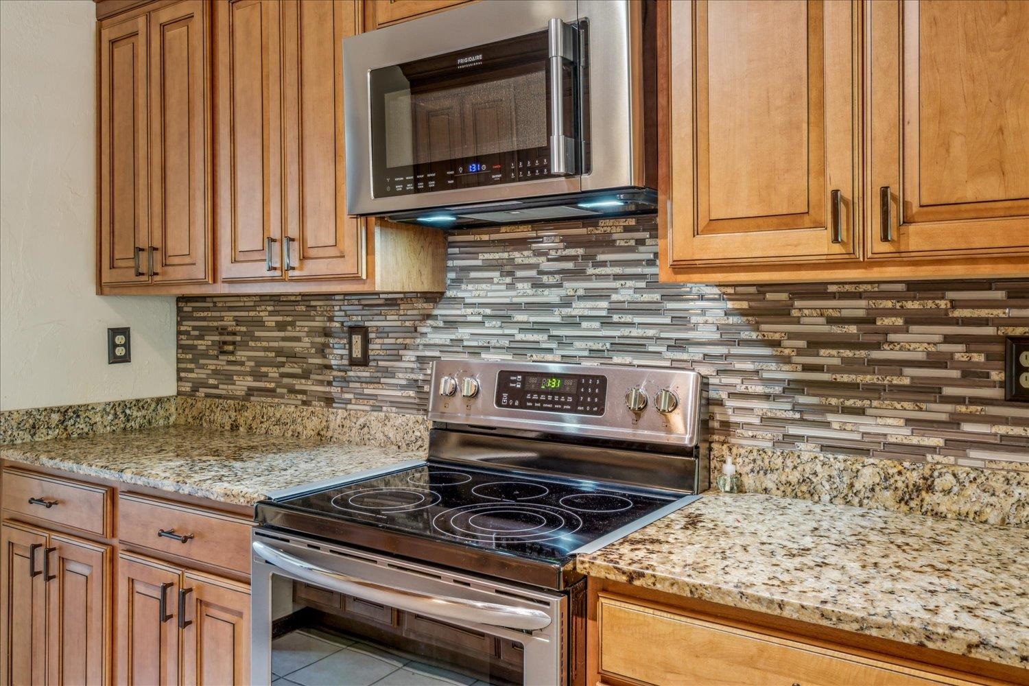 354 College Street Collierville, TN 38017 - Photo 13 of 33 a kitchen with a stove and a microwave