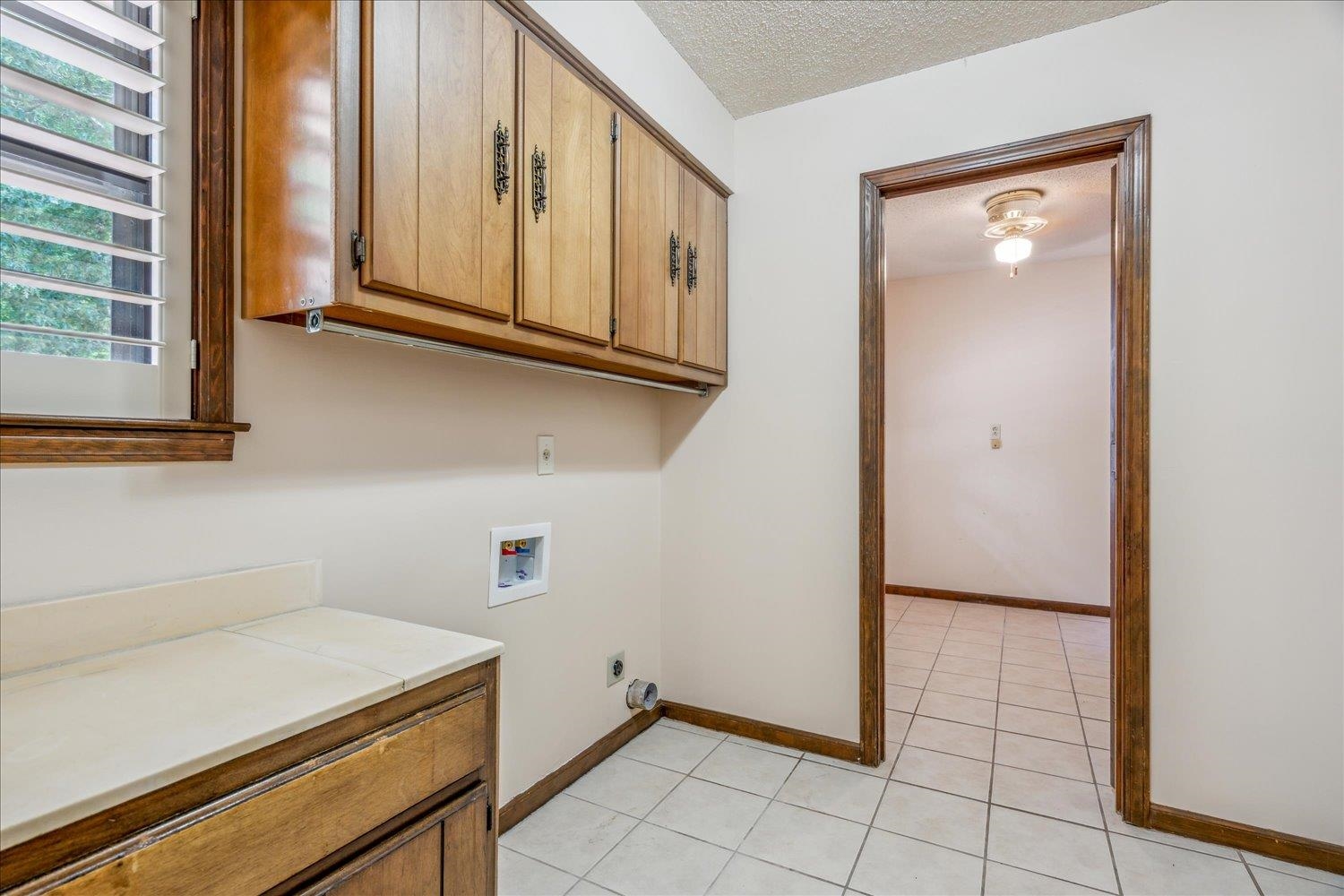354 College Street Collierville, TN 38017 - Photo 16 of 33 a view of a storage and utility room with washer and dryer