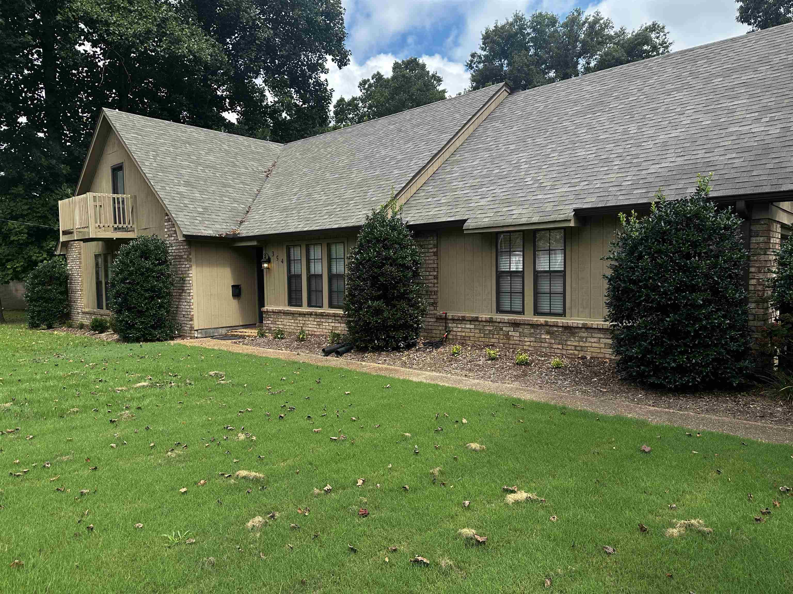 354 College Street Collierville, TN 38017 - Photo 2 of 33 a front view of a house with a garden and plants