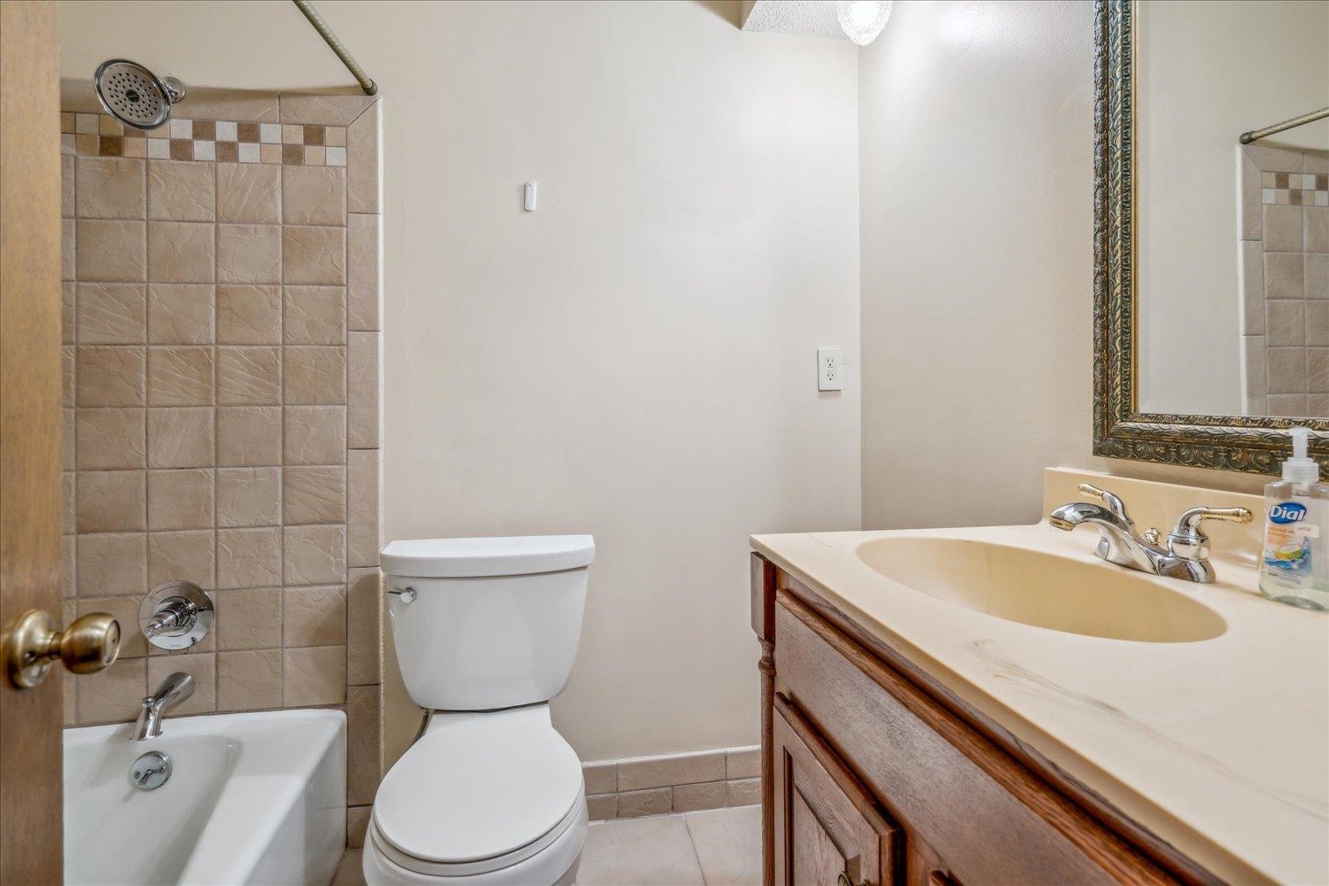 354 College Street Collierville, TN 38017 - Photo 21 of 33 a bathroom with a sink a toilet and a mirror