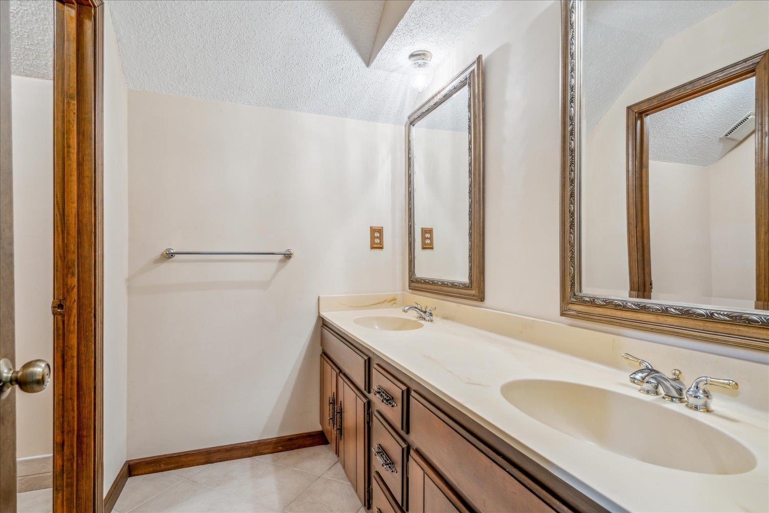 354 College Street Collierville, TN 38017 - Photo 24 of 33 a bathroom with a sink and a mirror