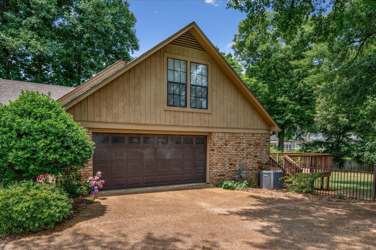 354 College Street Collierville, TN 38017 - Photo 27 of 33 a front view of a house with yard and trees