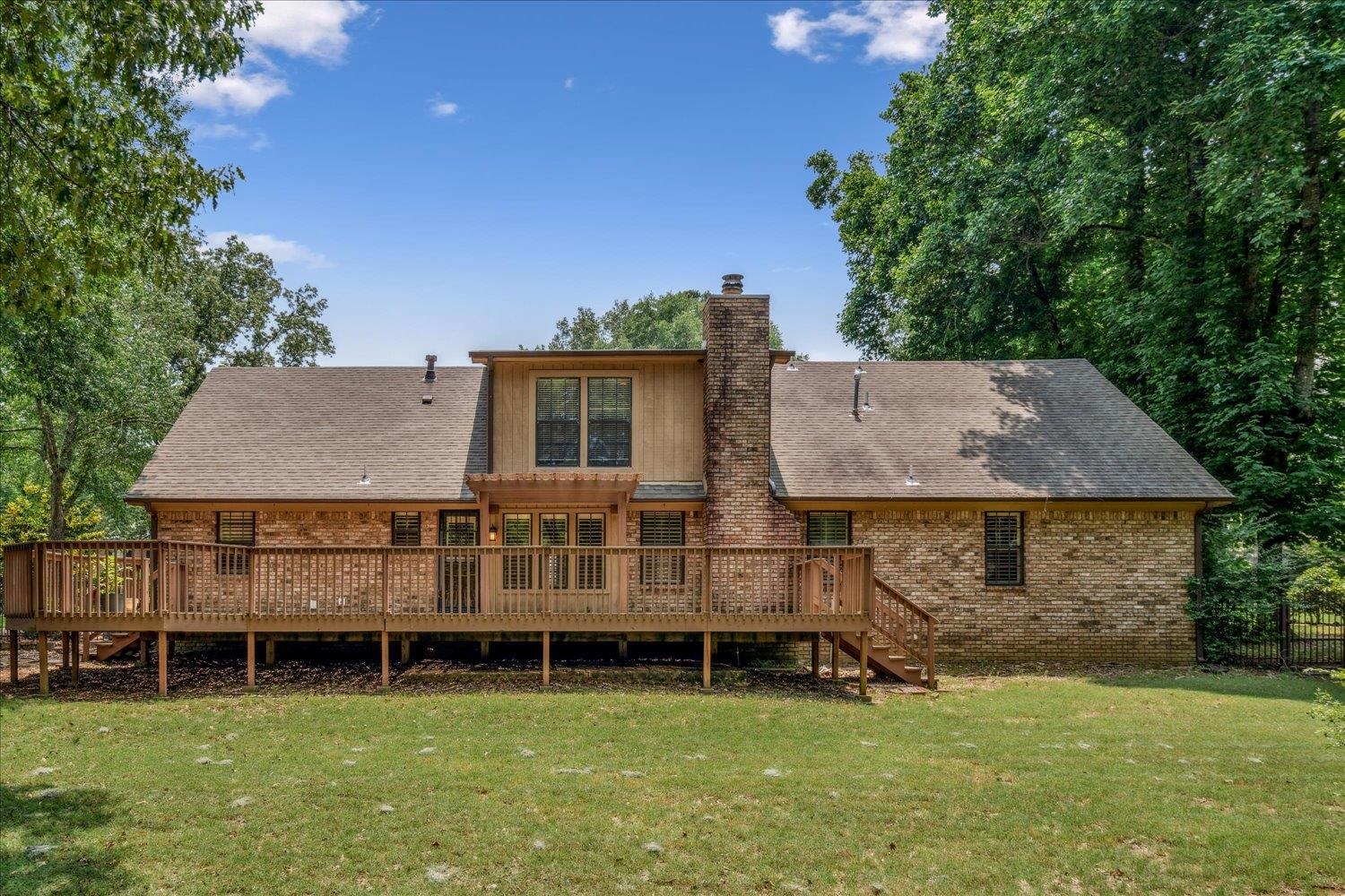 354 College Street Collierville, TN 38017 - Photo 29 of 33 a view of a house with a backyard and a patio