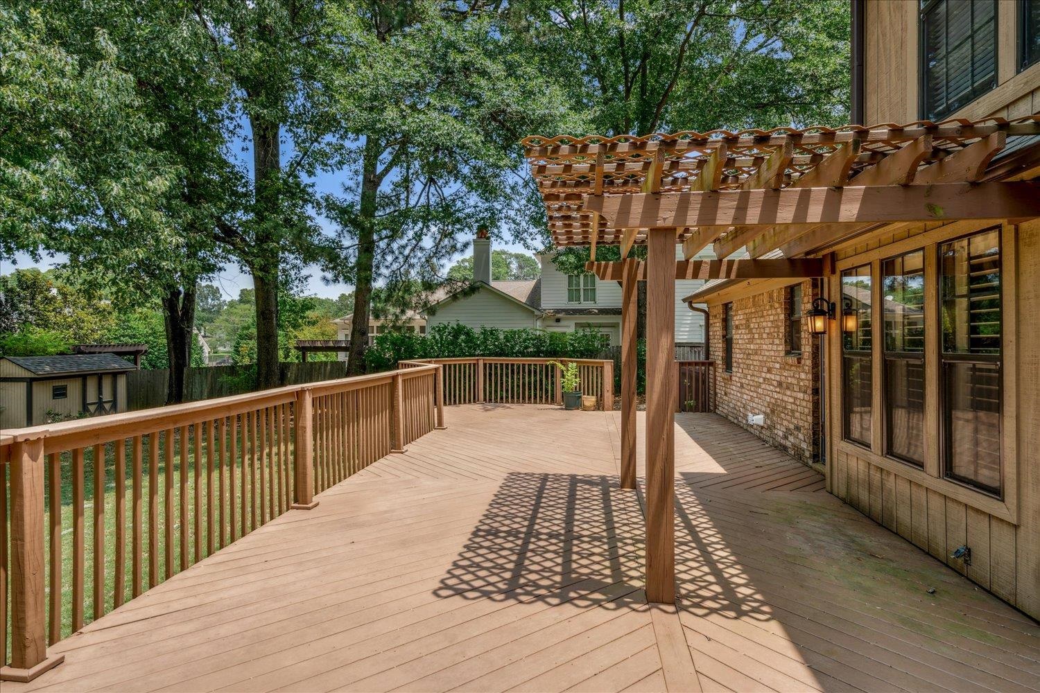 354 College Street Collierville, TN 38017 - Photo 31 of 33 a view of a wooden deck with a yard