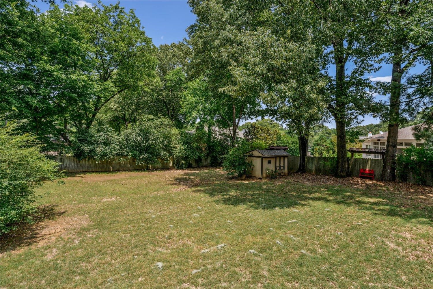 354 College Street Collierville, TN 38017 - Photo 33 of 33 a view of a backyard with large trees