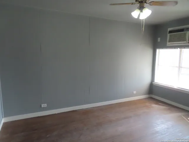 a view of a chandelier fan in a room
