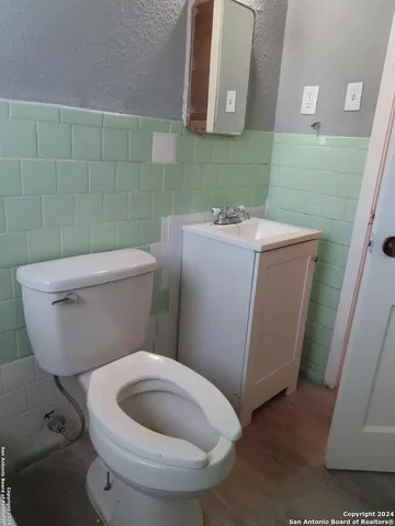a bathroom with a toilet and a sink