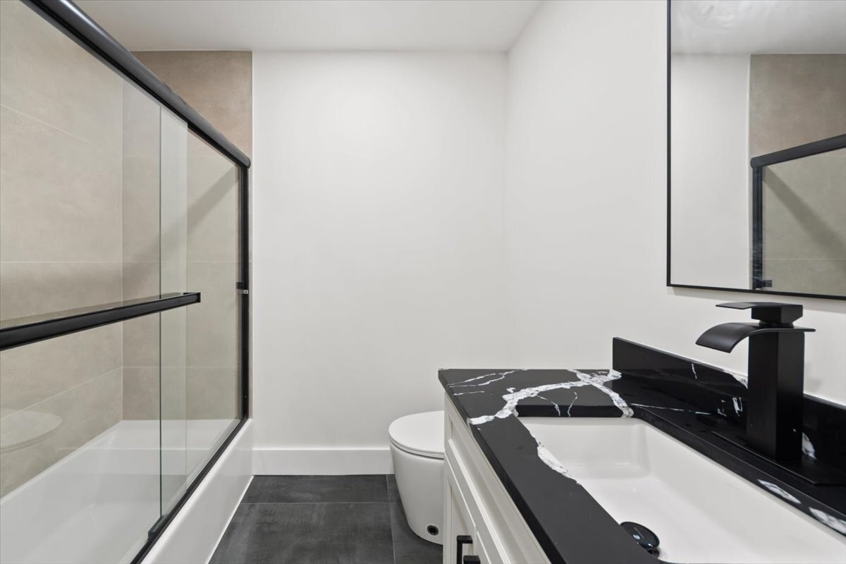 115 Mayfair Road Fairfield, CT 06824 - Photo 27 of 36 a bathroom with a sink and a mirror