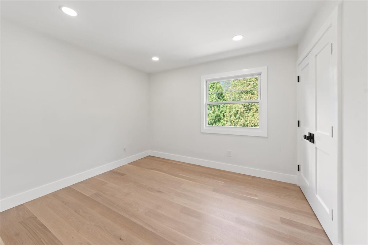 115 Mayfair Road Fairfield, CT 06824 - Photo 28 of 36 wooden floor in an empty room with a window