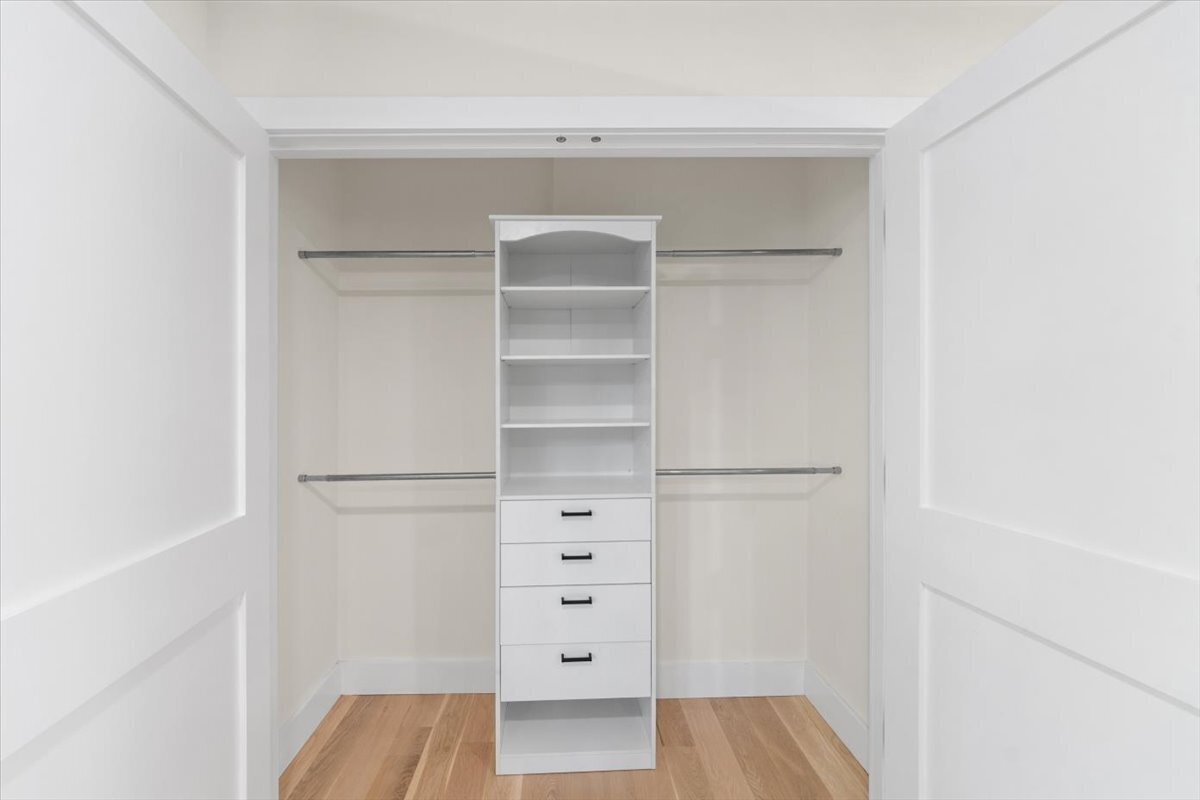 115 Mayfair Road Fairfield, CT 06824 - Photo 33 of 36 a view of walk in closet with empty racks