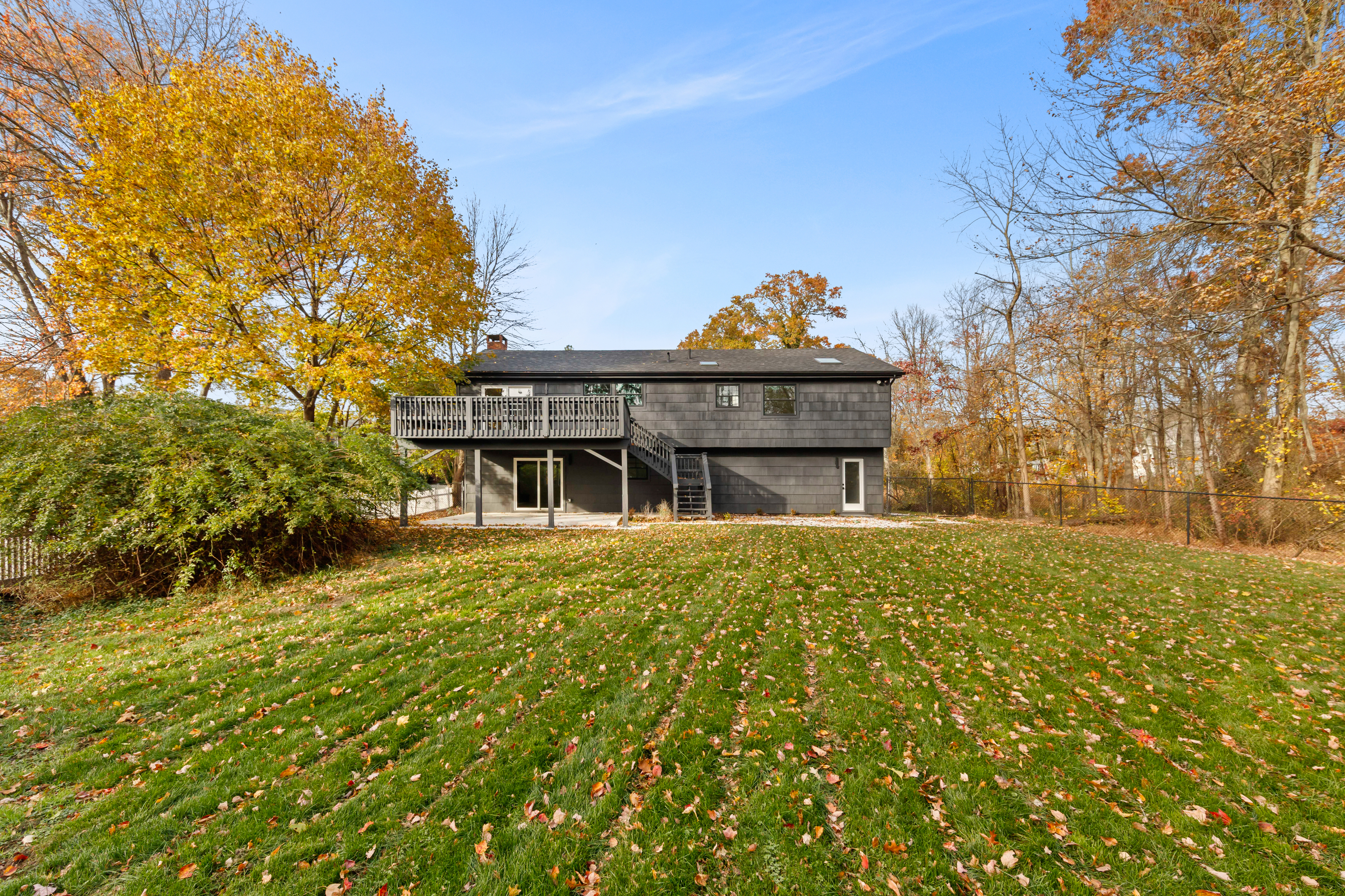 115 Mayfair Road Fairfield, CT 06824 - Photo 5 of 36 a front view of a house with a yard