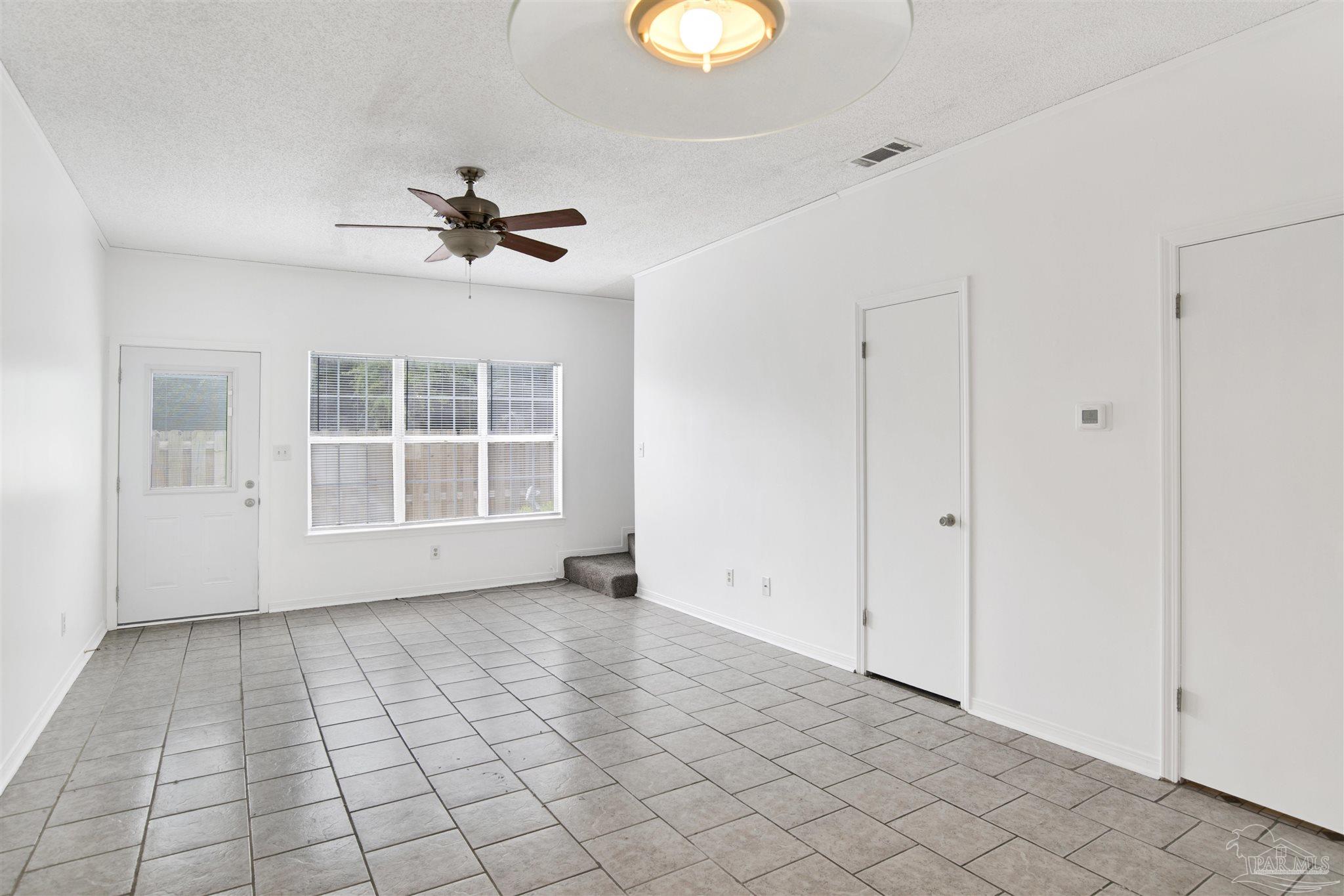 601 East Burgess Road, Unit K11 Pensacola, FL 32504 - Photo 11 of 34 a view of an empty room with a window