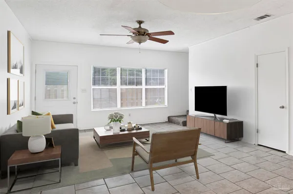 a living room with furniture and windows