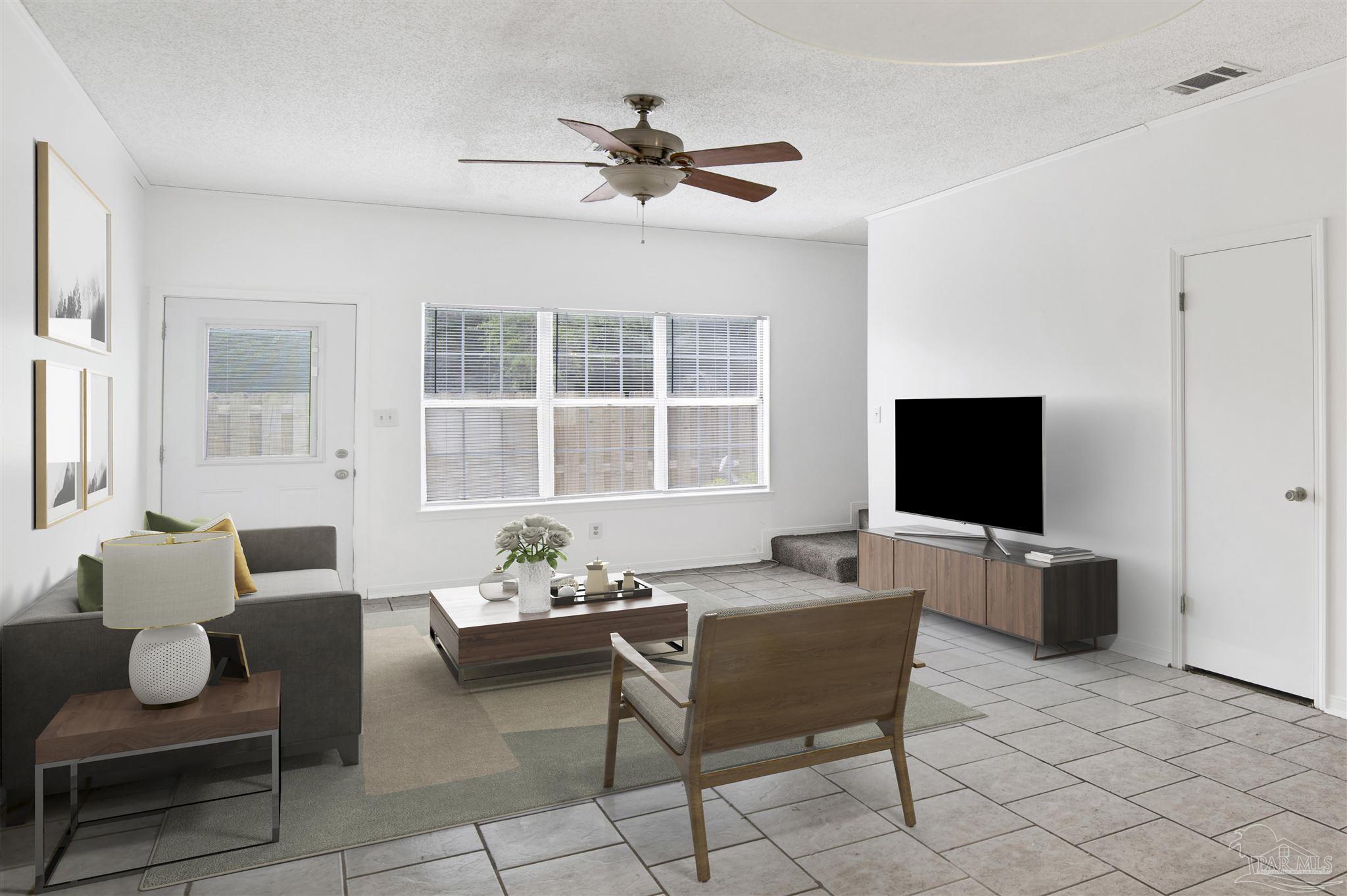 601 East Burgess Road, Unit K11 Pensacola, FL 32504 - Photo 12 of 34 a living room with furniture and windows