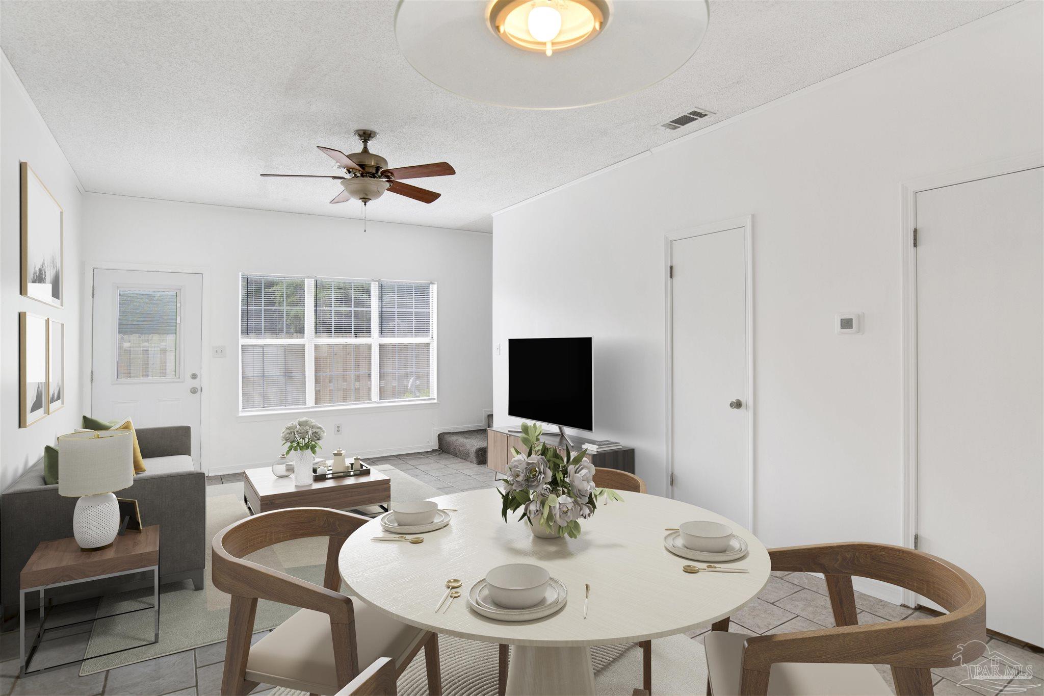 601 East Burgess Road, Unit K11 Pensacola, FL 32504 - Photo 14 of 34 a view of a dining room with furniture and wooden floor