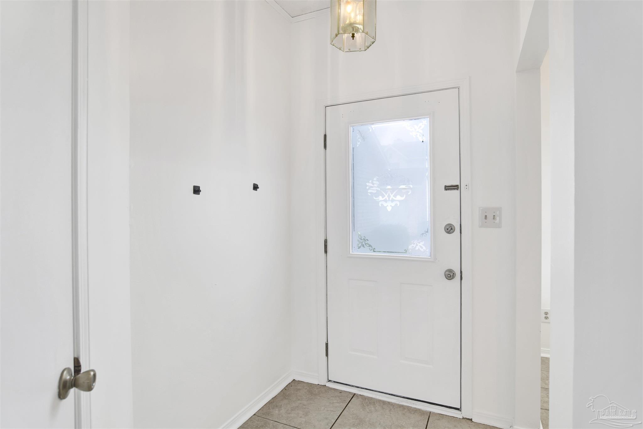 601 East Burgess Road, Unit K11 Pensacola, FL 32504 - Photo 2 of 34 a view of a bathroom with a glass shower door
