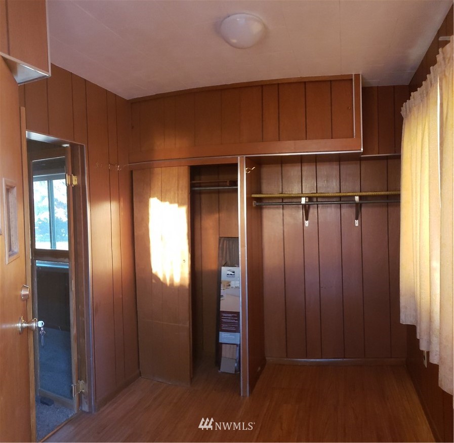 62 North Kirkpatrick Road North Omak, WA 98841 - Photo 10 of 33 a view of a hallway with wooden shelves