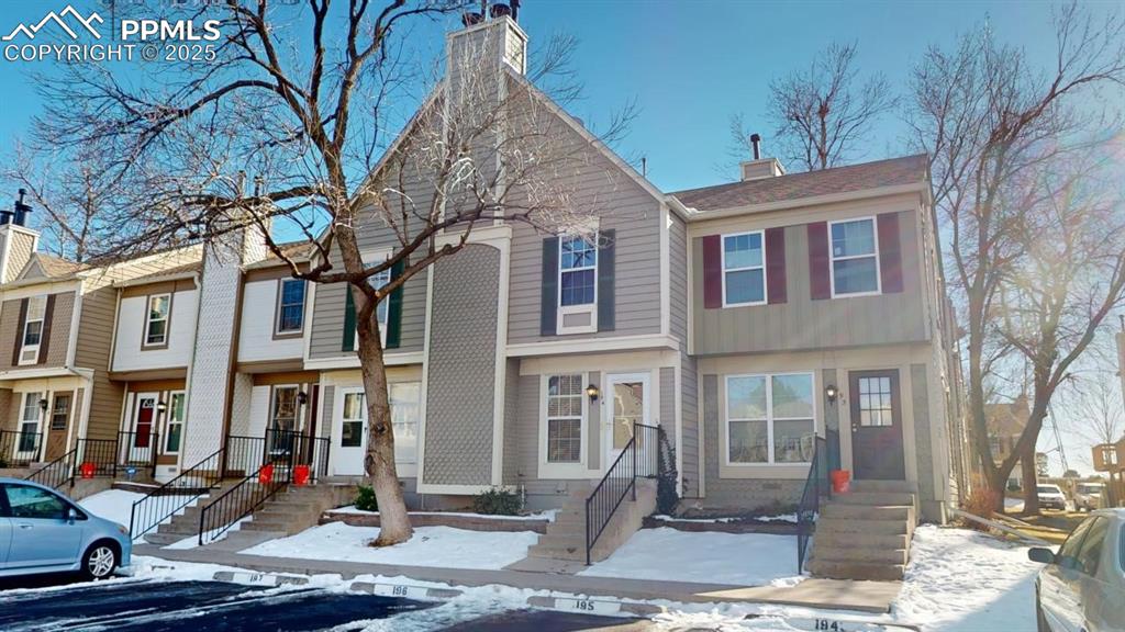 a front view of a house with street view