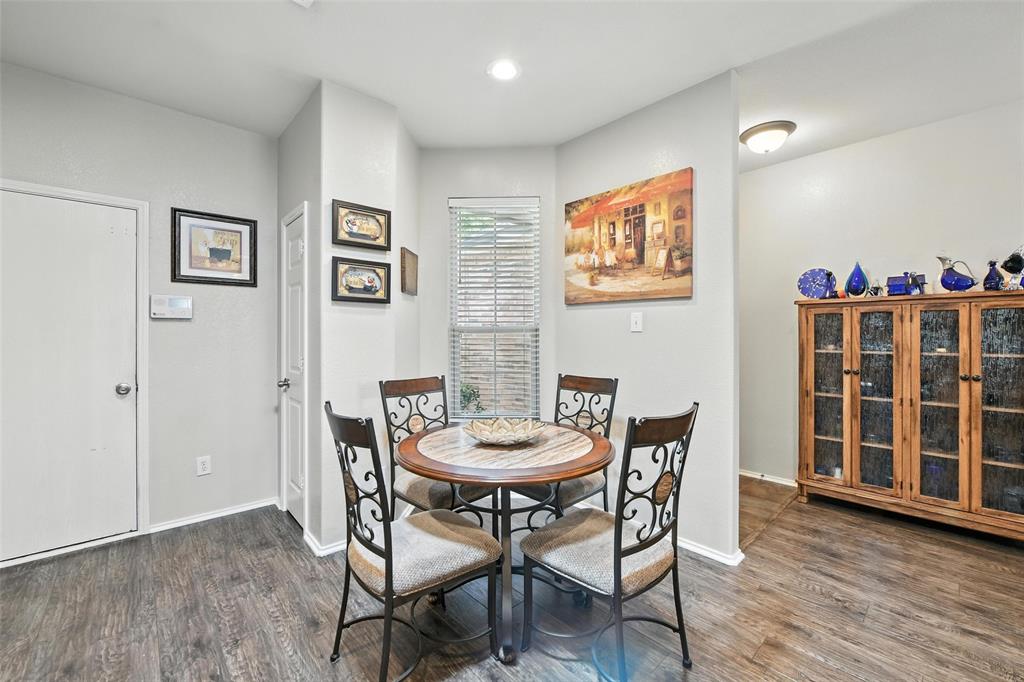 5817 Deck House Road Fort Worth, TX 76179 - Photo 18 of 28 a view of a dining room with furniture and wooden floor
