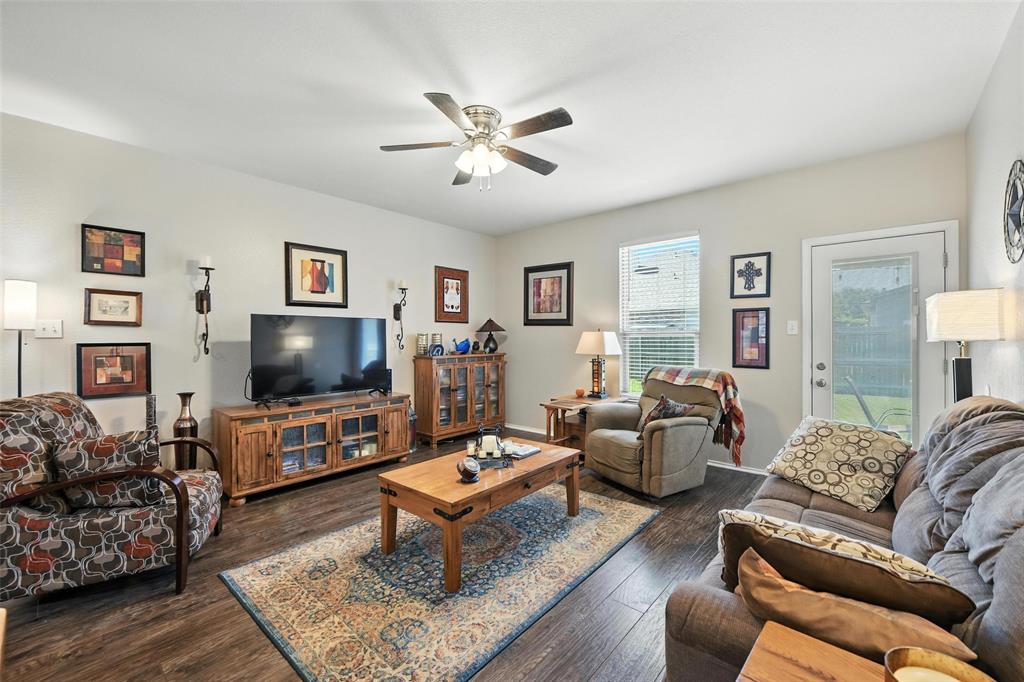 5817 Deck House Road Fort Worth, TX 76179 - Photo 24 of 28 a living room with furniture and a flat screen tv