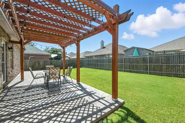 a view of swimming pool with a backyard