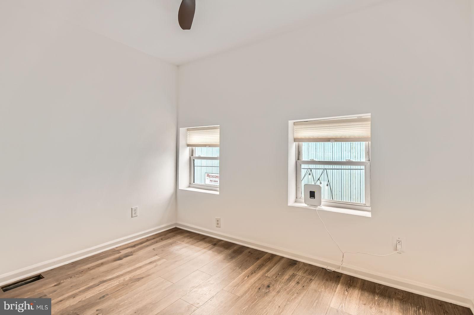 1440 Ward Street Baltimore, MD 21230 - Photo 13 of 27 an empty room with windows