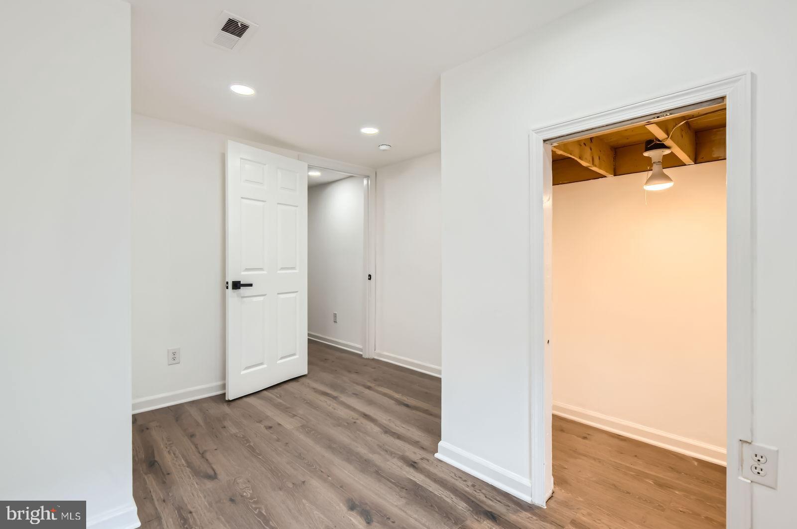 1440 Ward Street Baltimore, MD 21230 - Photo 22 of 27 a view of hallway with wooden floor