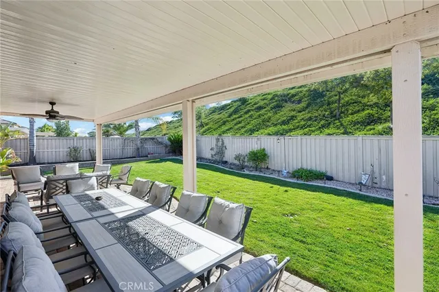 a view of a patio with chairs and table in patio
