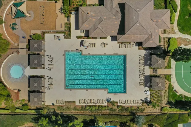an aerial view of a residential houses with outdoor space