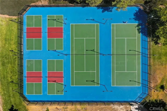 a view of a brick building with a yard in front of it