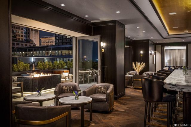 a living room with furniture and large window