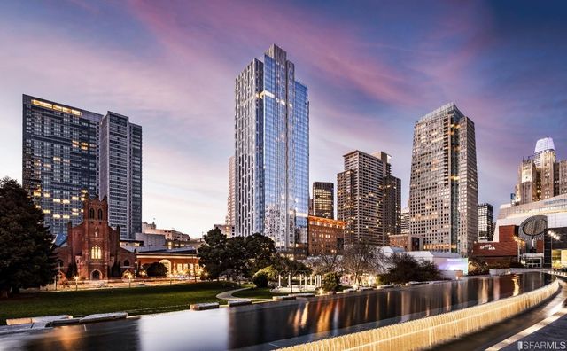 a view of a city with tall buildings