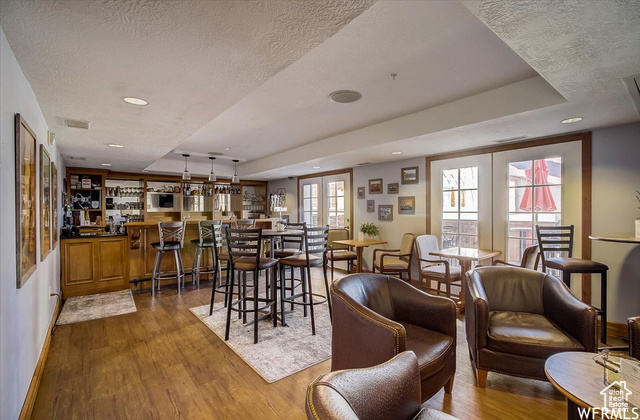 784 Resort Drive, Unit 206 Midway, UT 84049 - Photo 20 of 21 Dining area with a wealth of natural light, hardwood / wood-style floors, and a textured ceiling