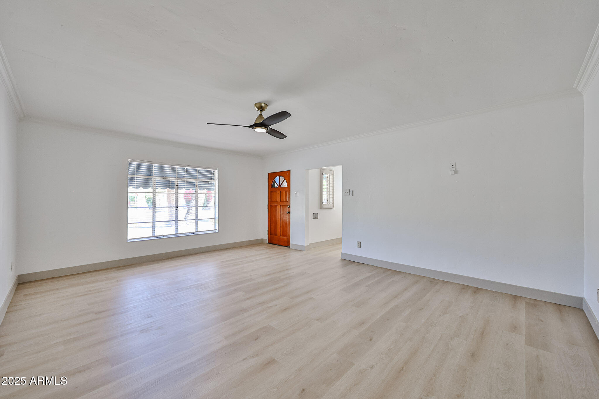 63 West Windsor Avenue Phoenix, AZ 85003 - Photo 11 of 43 a view of empty room with wooden floor and fan