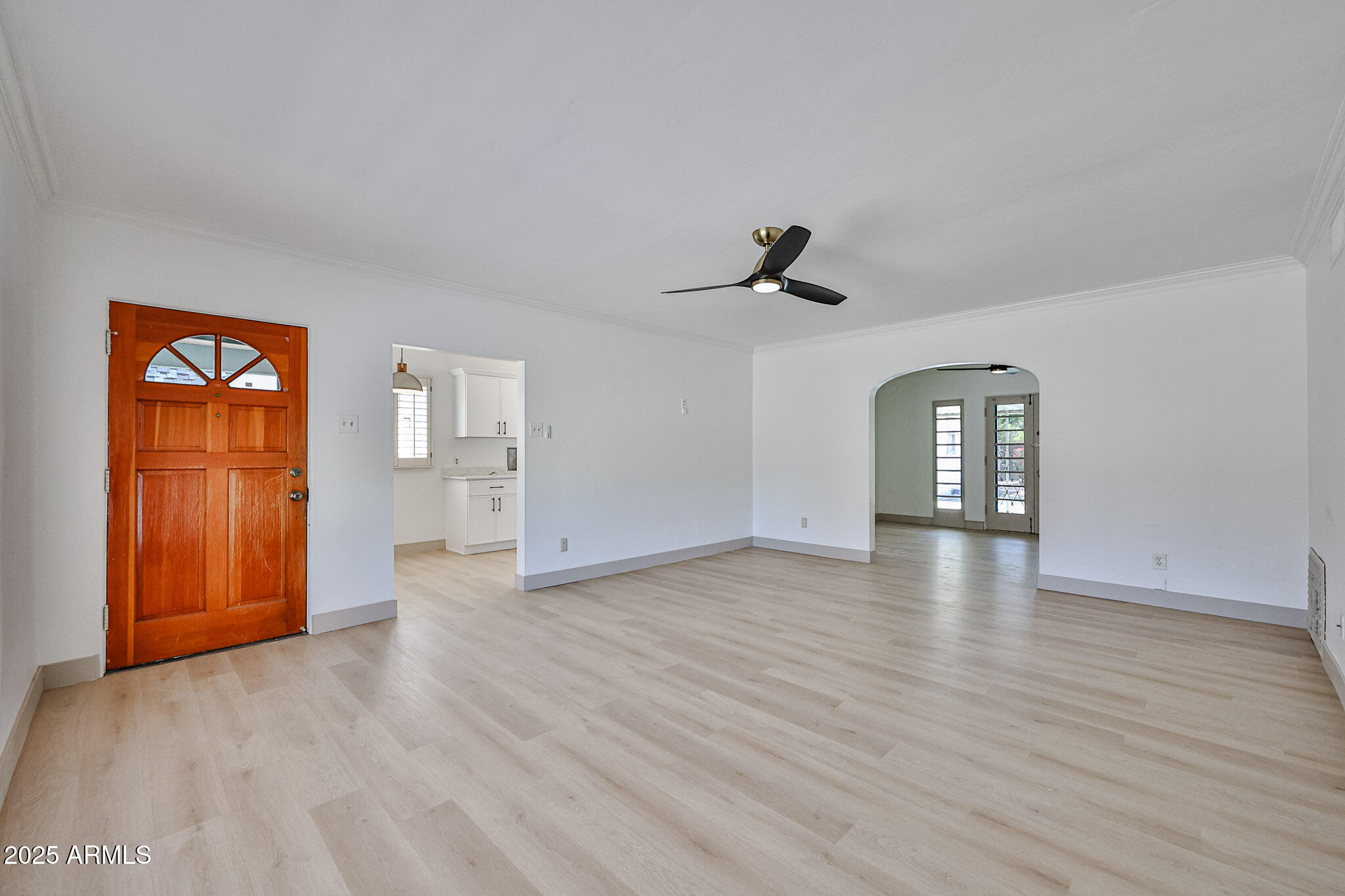 63 West Windsor Avenue Phoenix, AZ 85003 - Photo 12 of 43 wooden floor in an empty room with a window