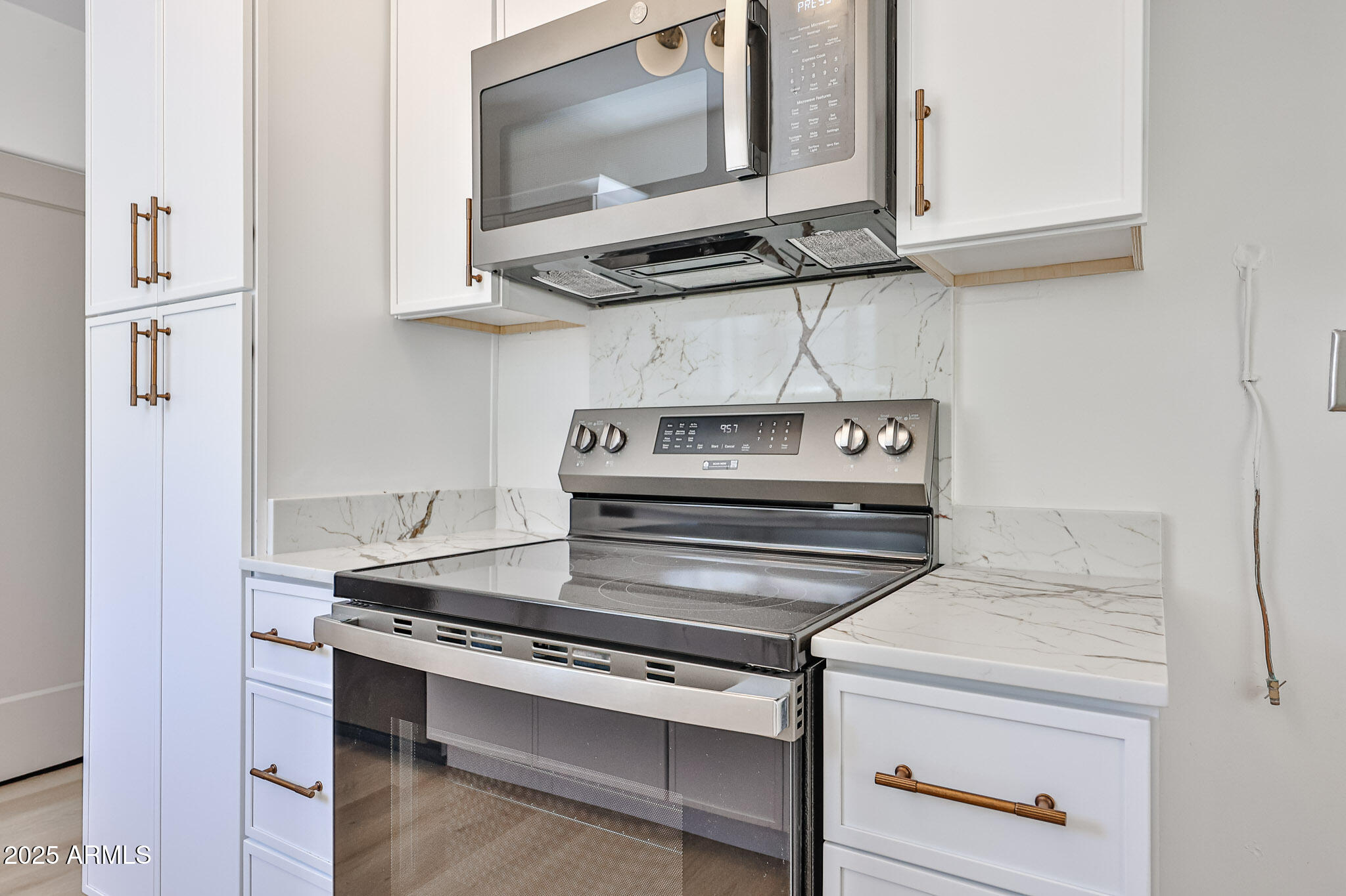 63 West Windsor Avenue Phoenix, AZ 85003 - Photo 18 of 43 a stove top oven sitting inside of a kitchen
