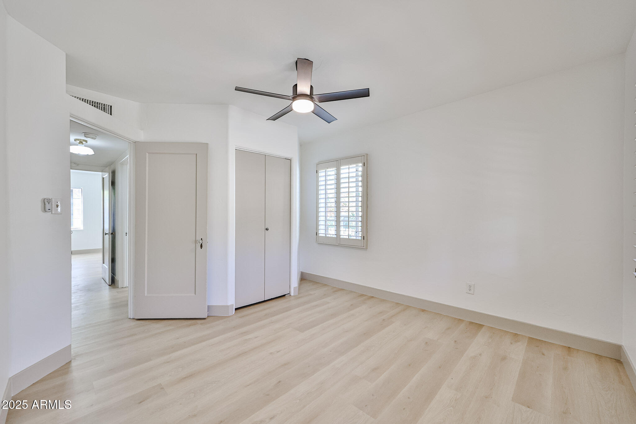 63 West Windsor Avenue Phoenix, AZ 85003 - Photo 25 of 43 wooden floor in an empty room with a window