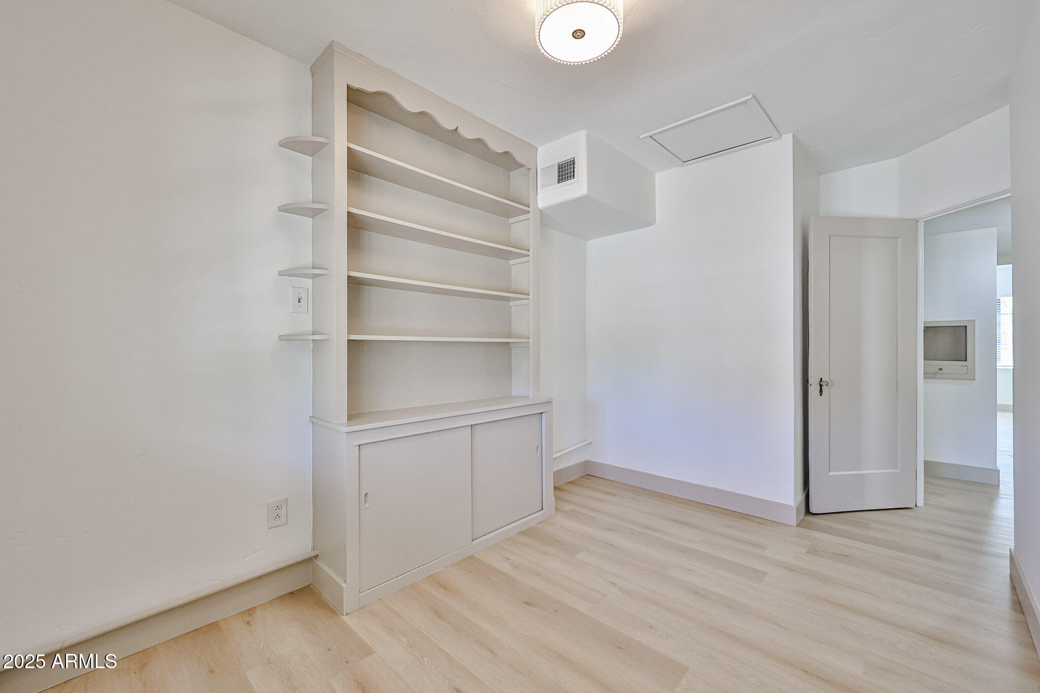 63 West Windsor Avenue Phoenix, AZ 85003 - Photo 27 of 43 a view of an empty walk in closet with empty racks