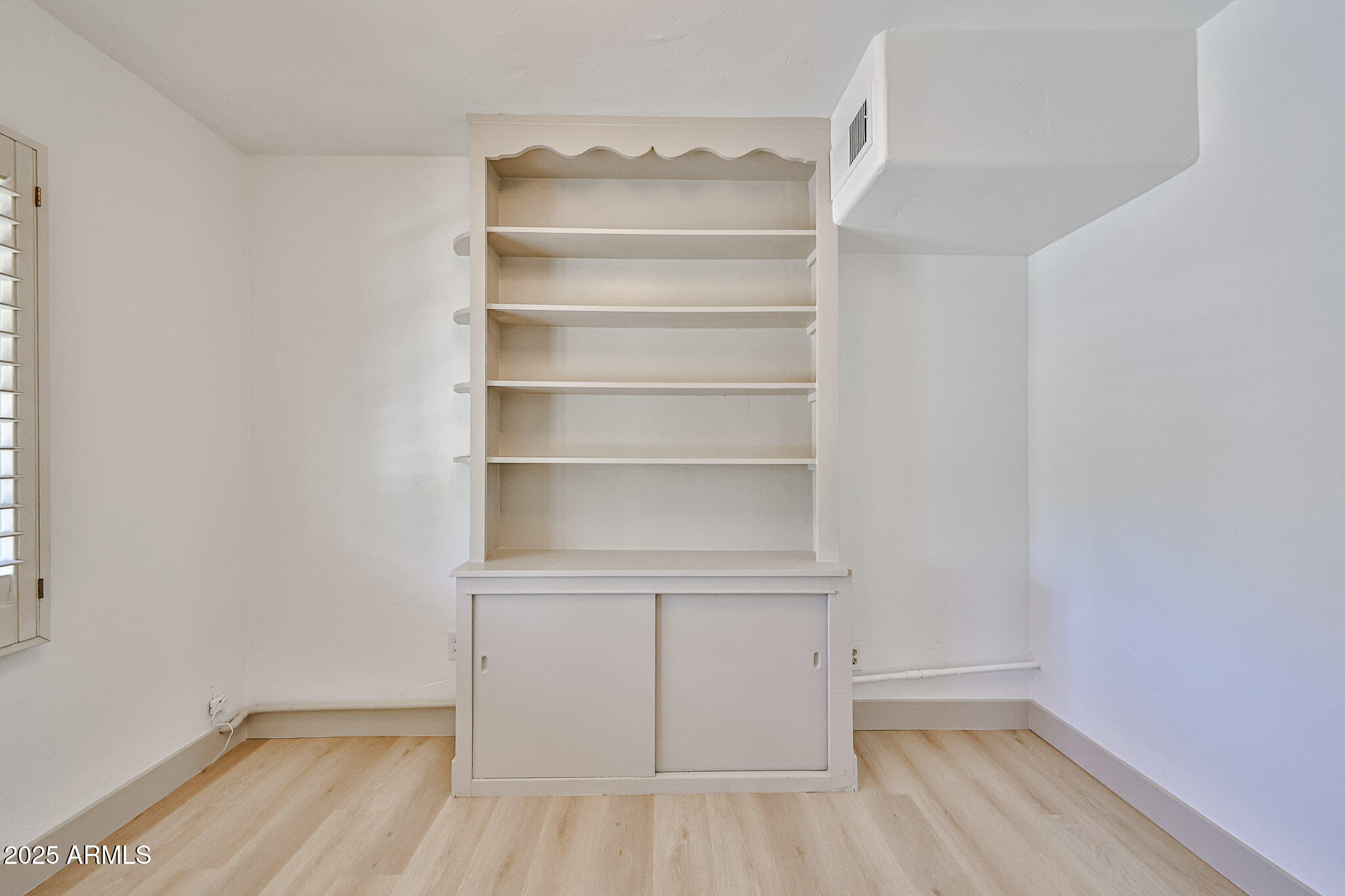 63 West Windsor Avenue Phoenix, AZ 85003 - Photo 29 of 43 a view of a room with rack on the wall
