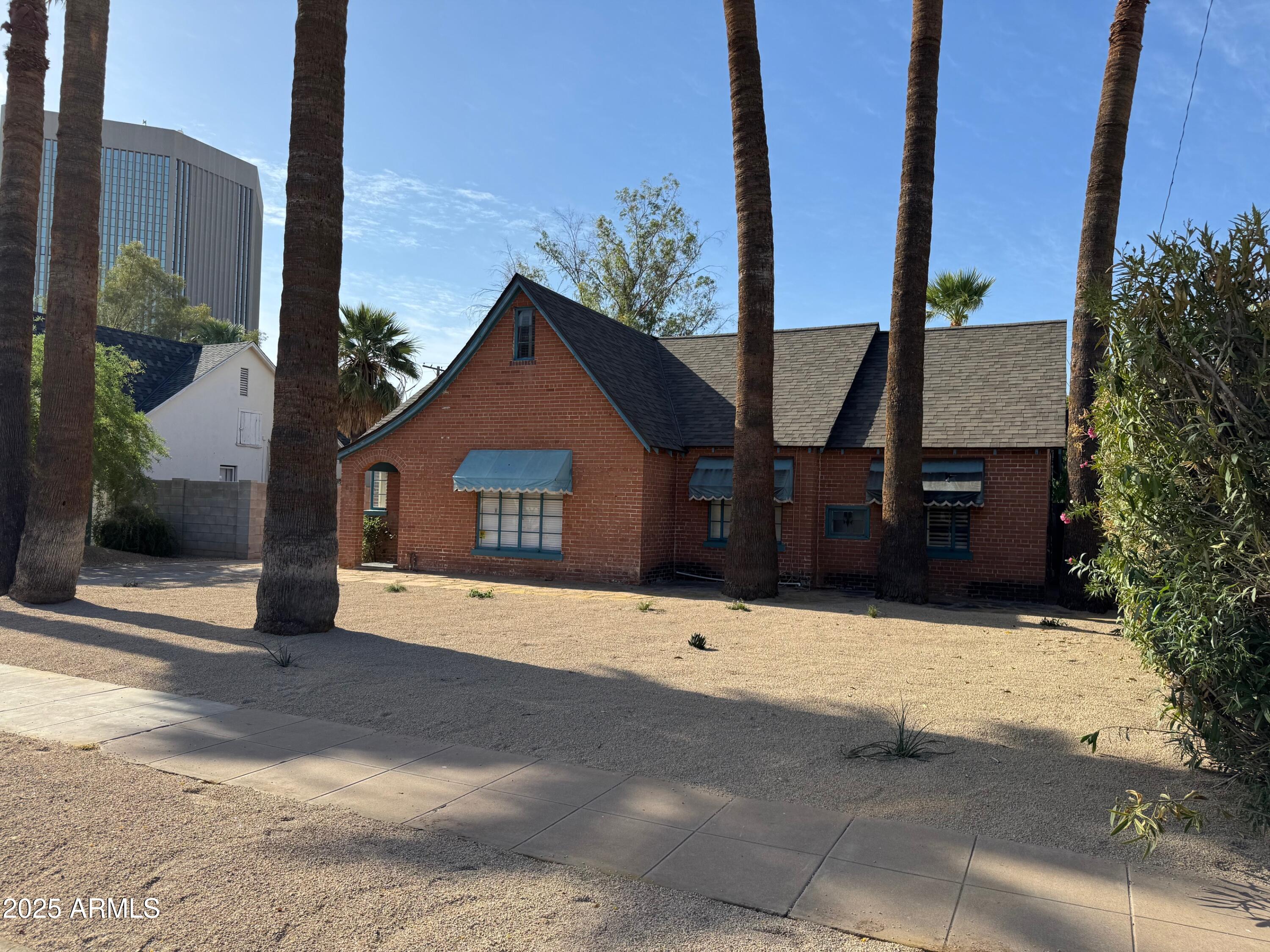 63 West Windsor Avenue Phoenix, AZ 85003 - Photo 2 of 43 a view of house with a yard and garage