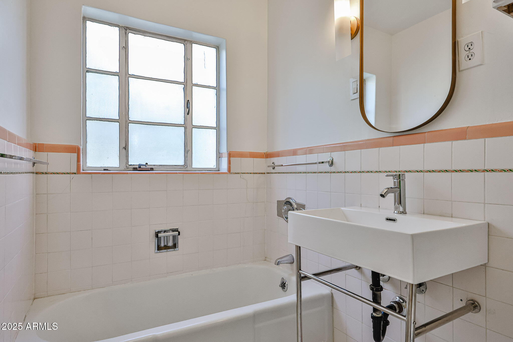63 West Windsor Avenue Phoenix, AZ 85003 - Photo 30 of 43 a bathroom with a sink and a mirror