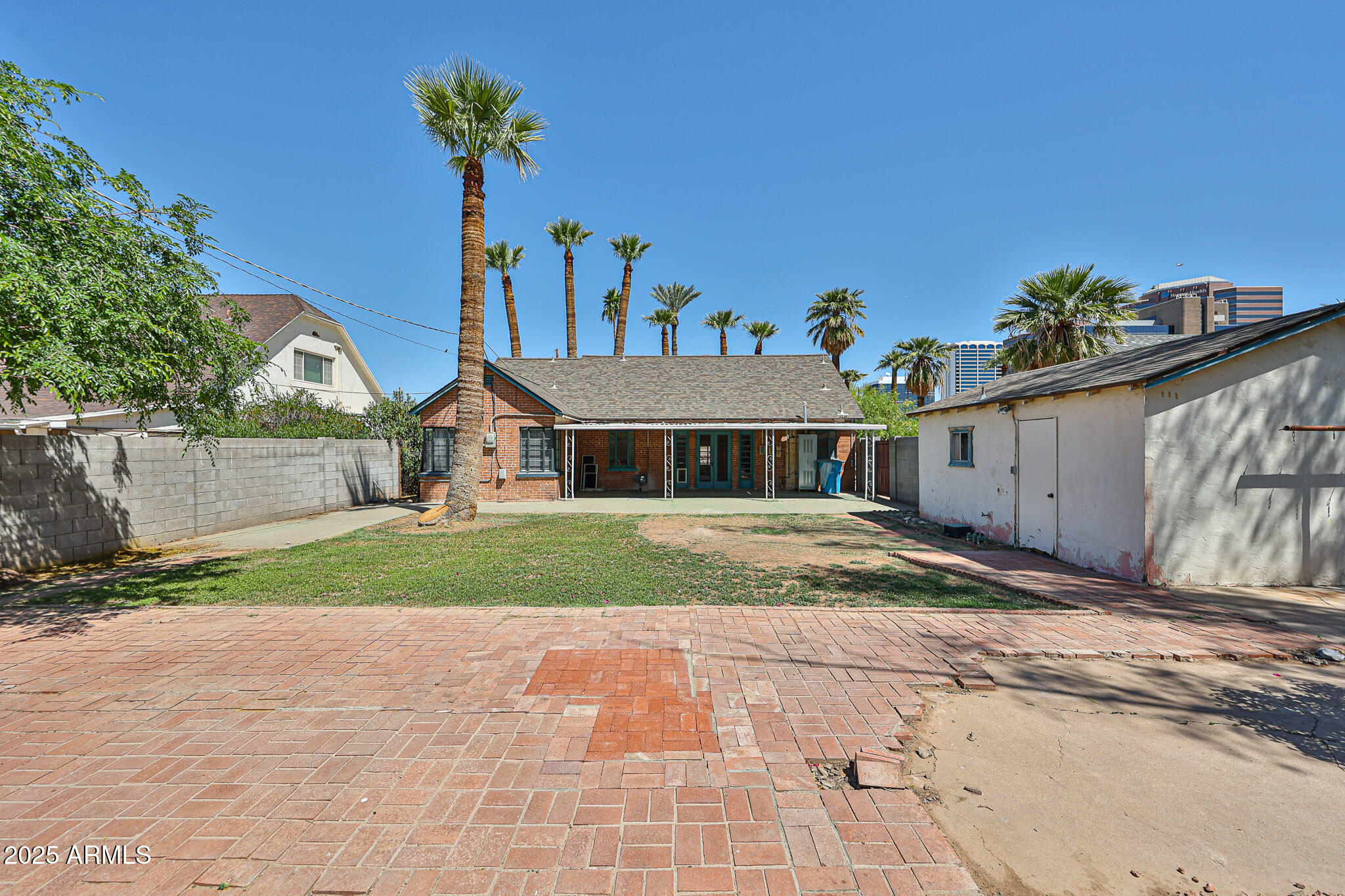 63 West Windsor Avenue Phoenix, AZ 85003 - Photo 38 of 43 a front view of a house with a yard and a garage