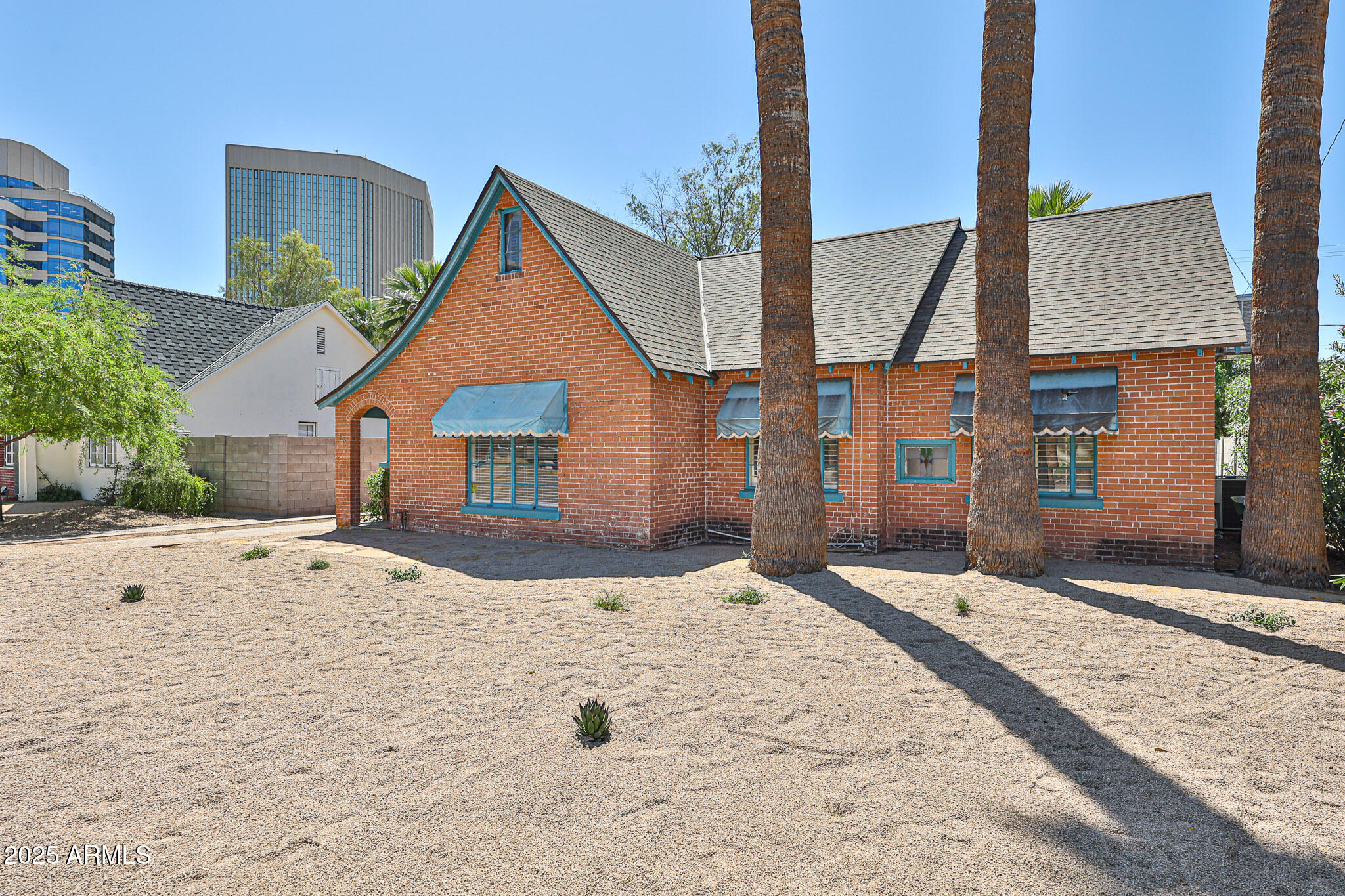 63 West Windsor Avenue Phoenix, AZ 85003 - Photo 5 of 43 a view of yellow house with a yard
