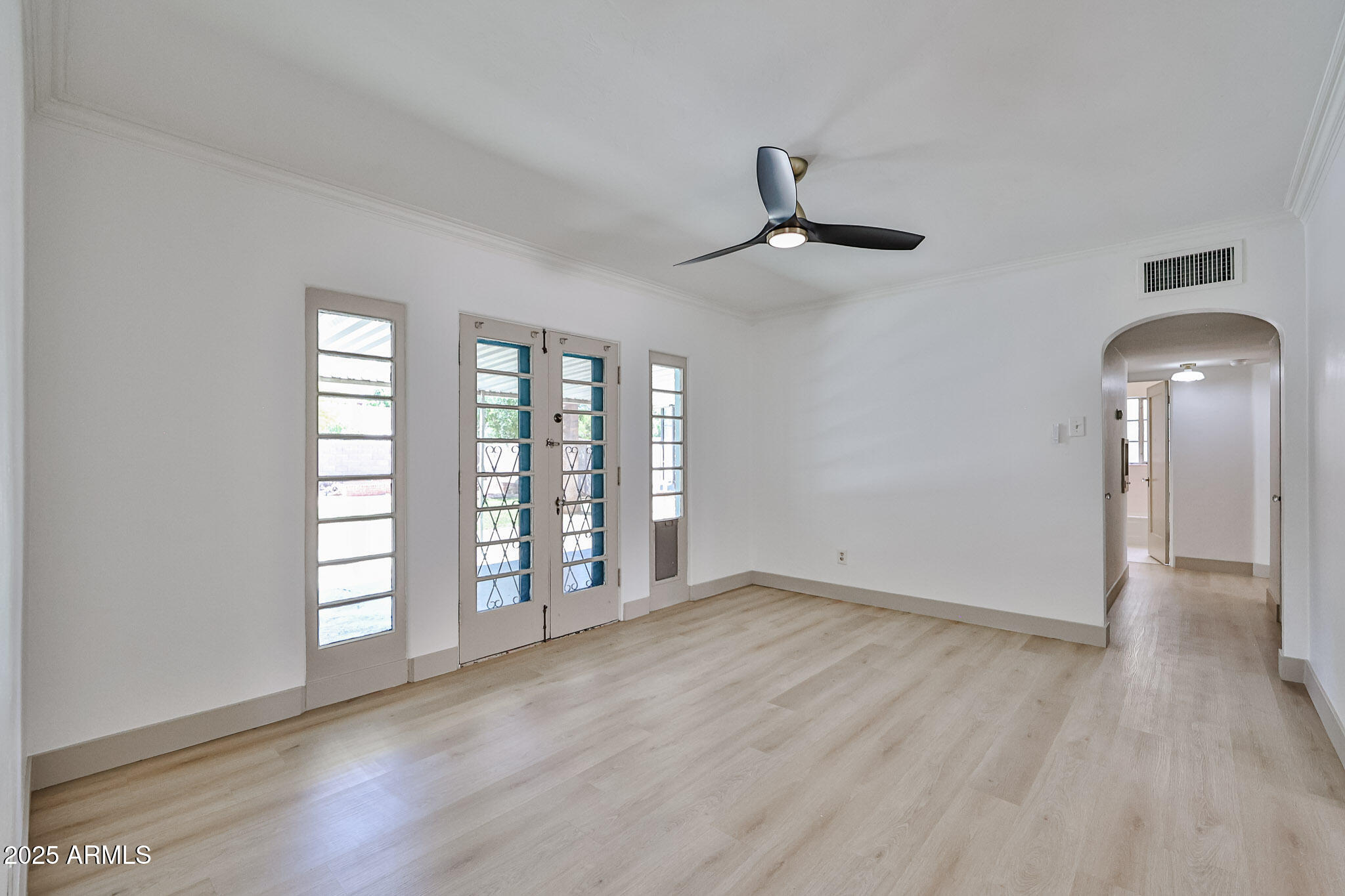 63 West Windsor Avenue Phoenix, AZ 85003 - Photo 8 of 43 wooden floor in an empty room with a window