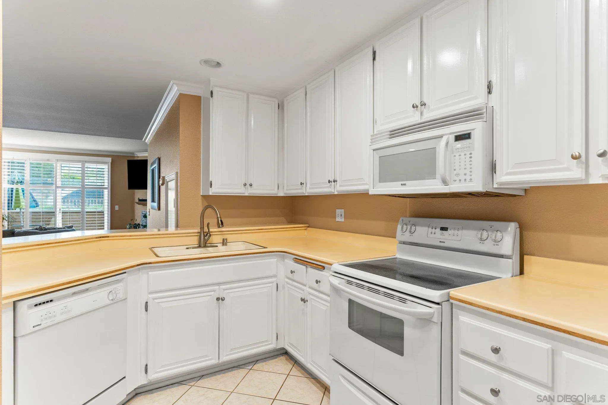 13801 Pinkard Way, Unit 8 El Cajon, CA 92021 - Photo 12 of 29 a view of a kitchen with white cabinets