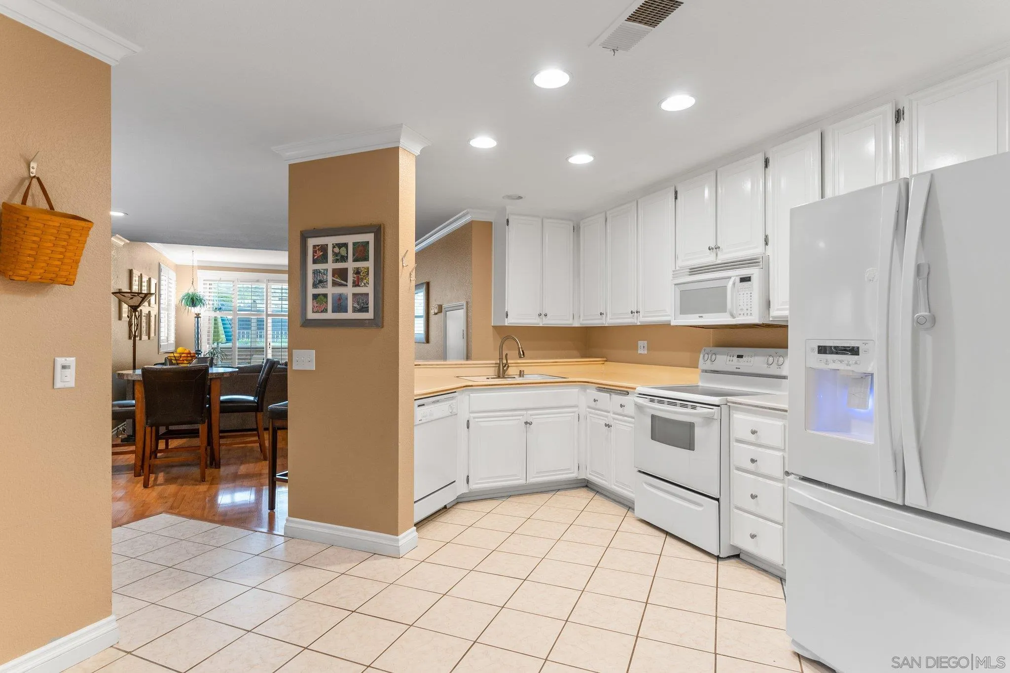 13801 Pinkard Way, Unit 8 El Cajon, CA 92021 - Photo 13 of 29 a kitchen with white cabinets and white appliances