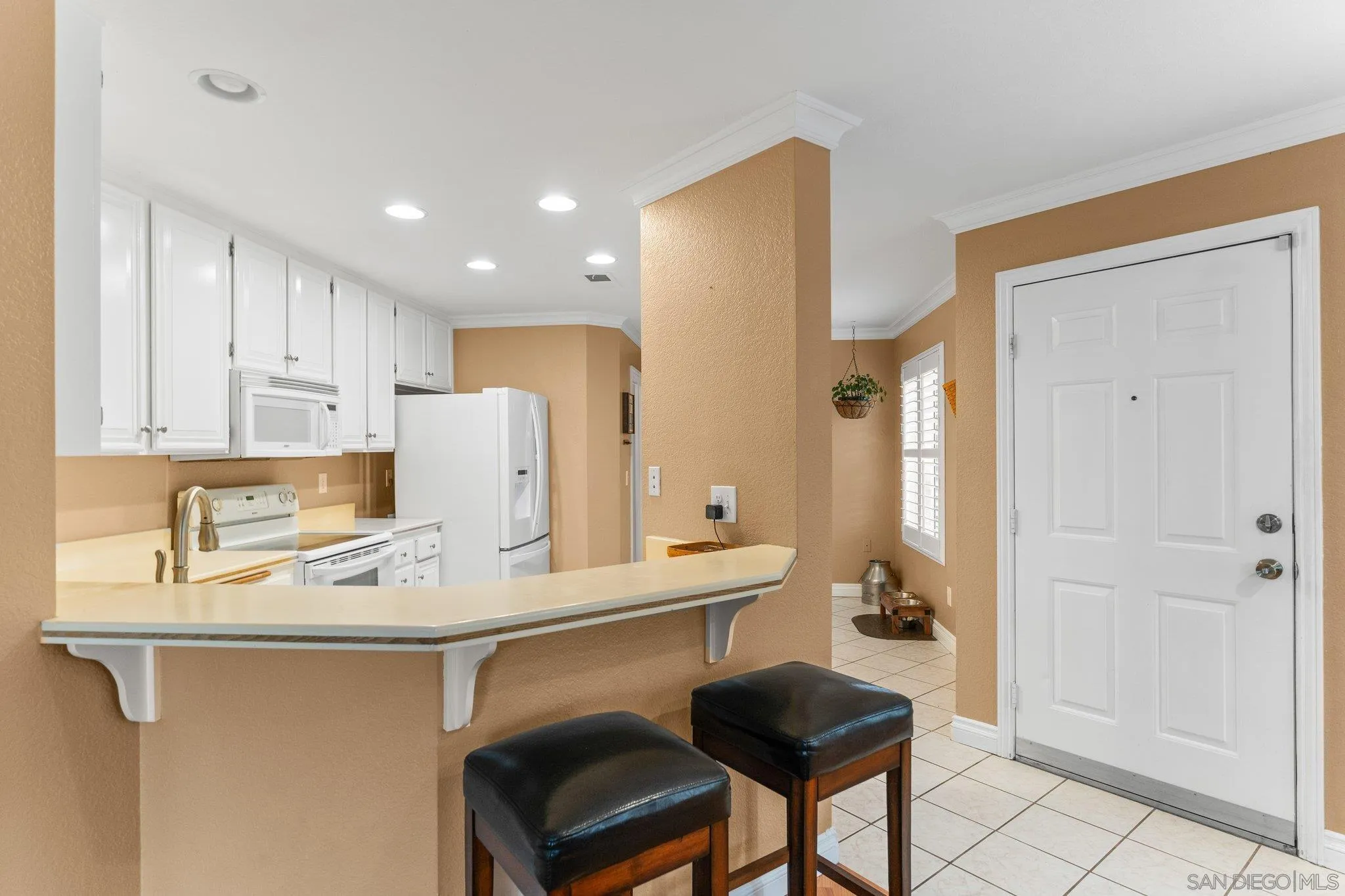 13801 Pinkard Way, Unit 8 El Cajon, CA 92021 - Photo 15 of 29 a kitchen with stainless steel appliances granite countertop a sink a stove a refrigerator and cabinets
